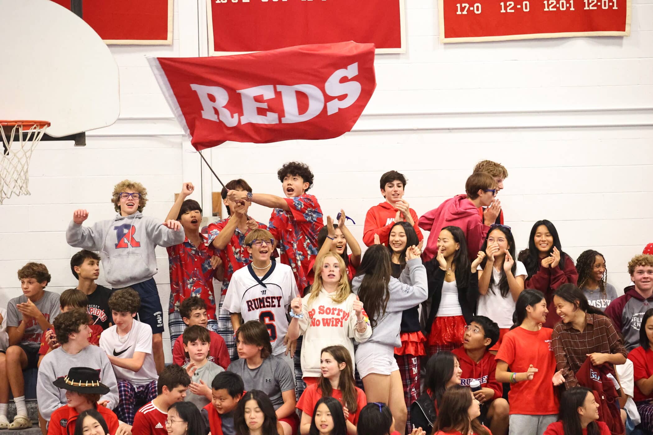 Students in crowd waving flag